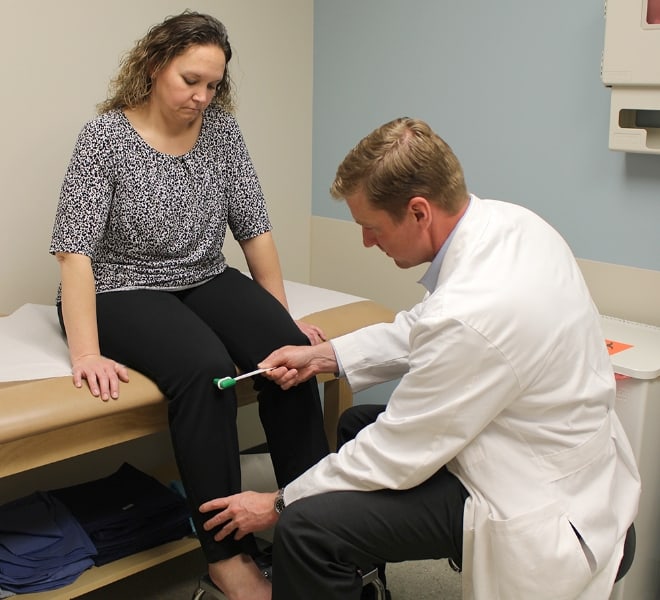 Dr. Kevin O'Neill examining a patient